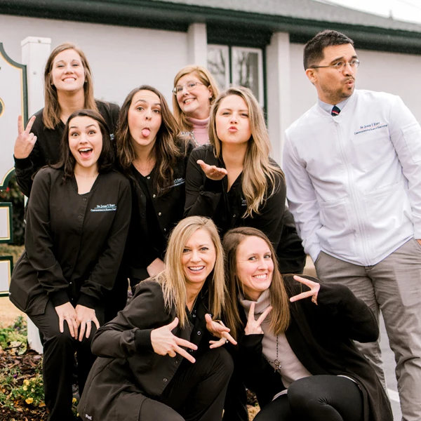 Dentist LaGrange GA Jared Kent and Staff Silly Group Shot The staff at LaGrange Dentistry are seen making silly faces at the camera with Dr. Kent looking off to the right